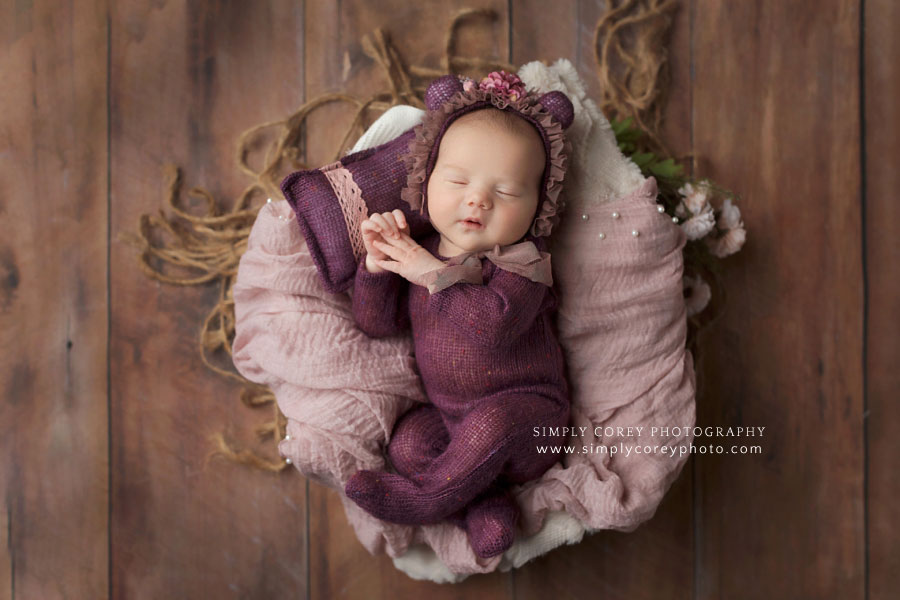 Newnan newborn photographer, baby girl in purple knit teddy bear sleeper