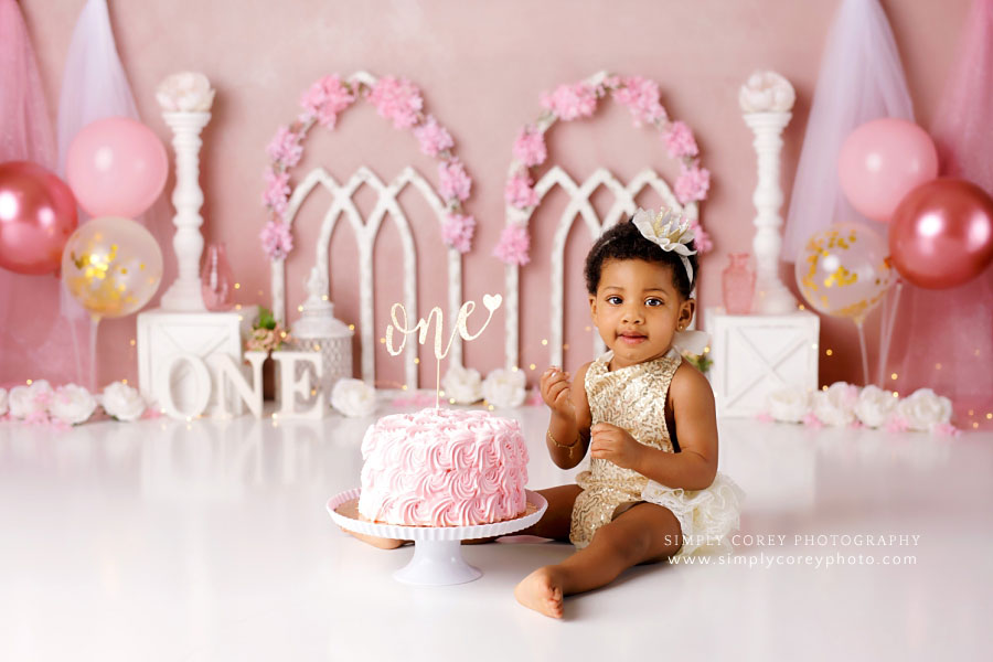 cake smash photographer near Villa Rica, baby girl princess themed studio set with balloons