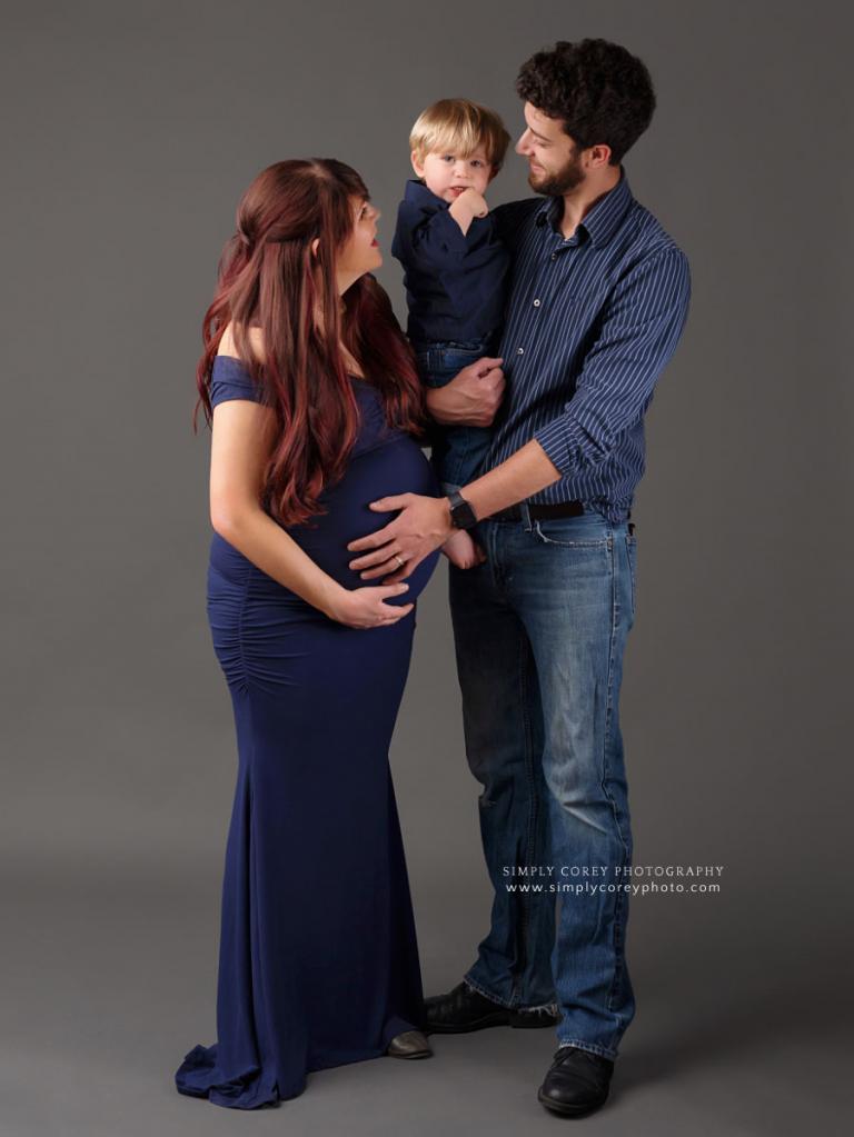 West Georgia family photographer, mom dad and toddler during maternity session