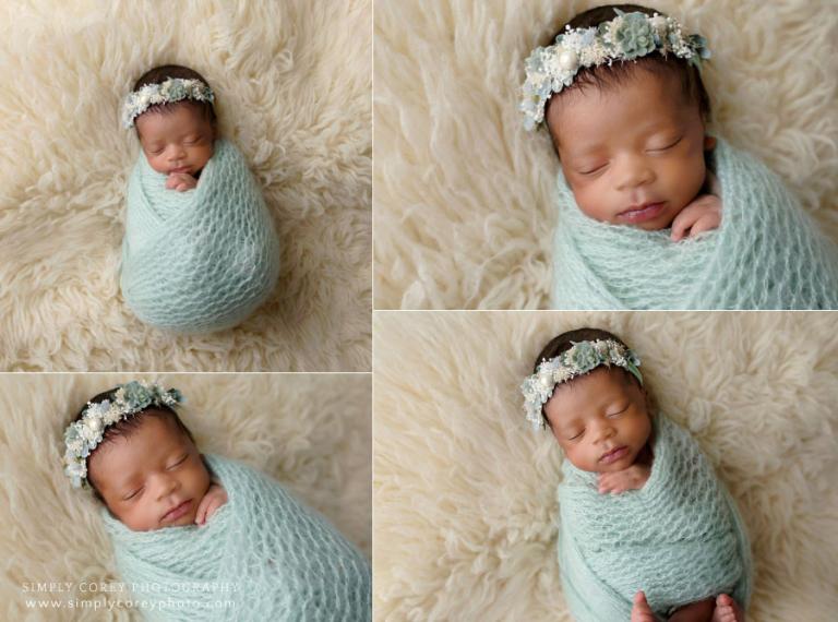 newborn photographer near Douglasville, baby girl on flokati in mint green knit wrap