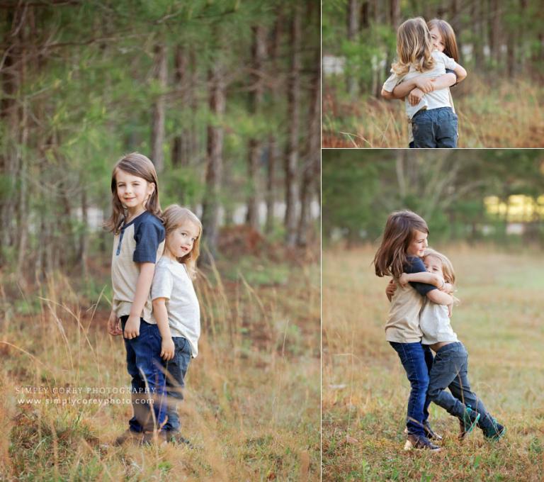 Villa Rica family photographer, brothers hugging outside in field