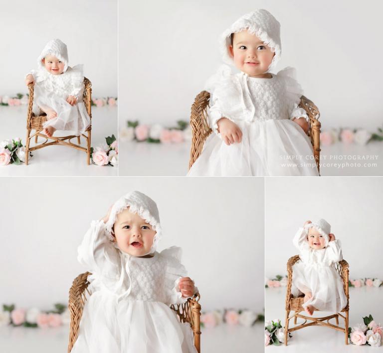 baby photographer near Dallas, GA; girl in white with wicker chair and flowers