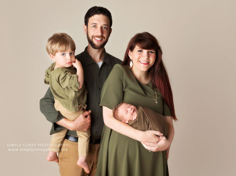 Newnan family photographer, studio newborn session with smiling baby and toddler