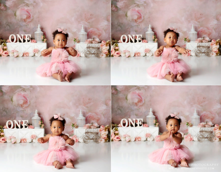 Atlanta baby photographer, toddler making funny expressions before pink floral cake smash