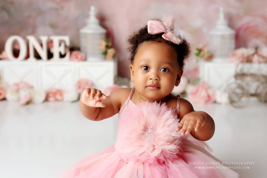 baby photographer near Villa Rica, one year old in pink tulle dress before cake smash