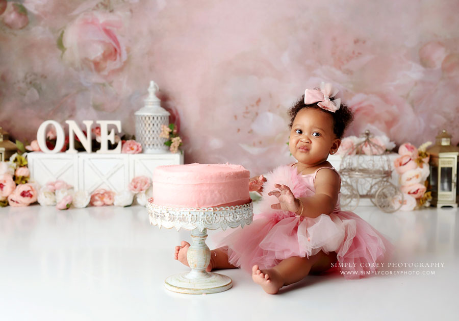 cake smash photographer near Carrollton, GA; baby scrunching face in response to cake