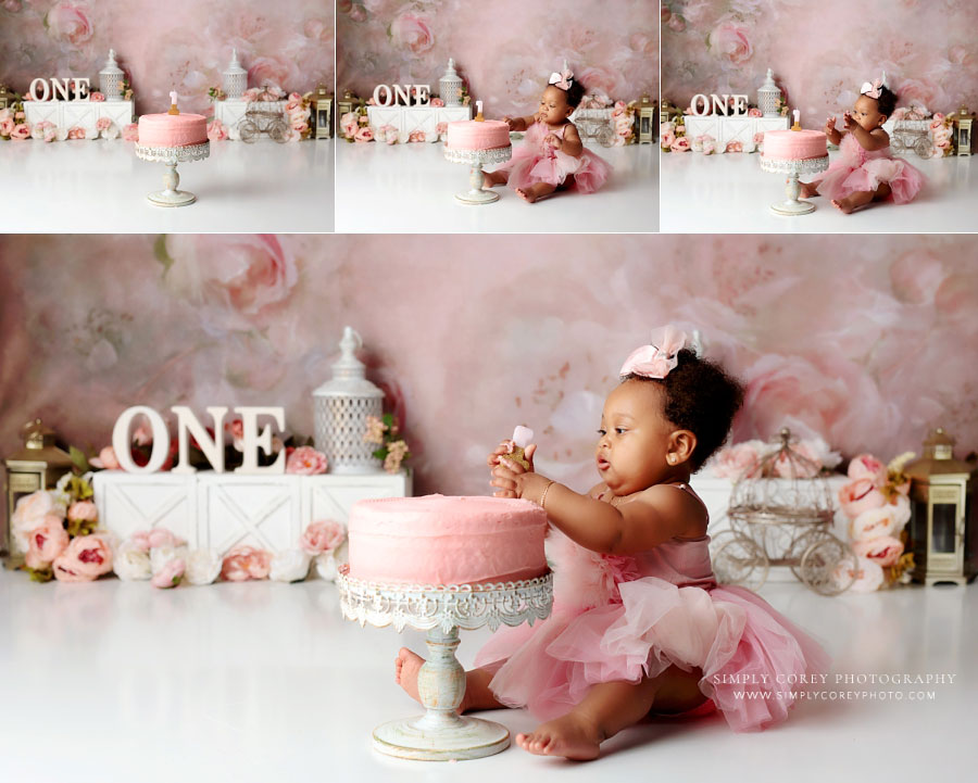 cake smash photographer near Dallas, GA; baby in pink tulle dress in studio