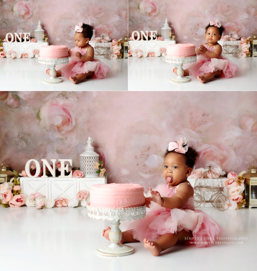 Villa Rica cake smash photographer, baby girl sticking tongue out in response to cake