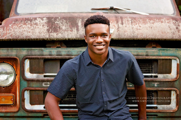 Atlanta senior portrait photographer, teen by vintage truck outside