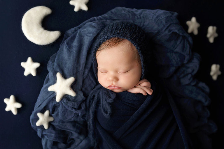 newborn photographer near Newnan, baby boy in navy blue with stars and moon