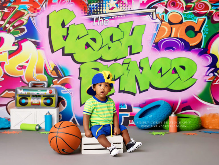 baby photographer near Atlanta, boy with hat and basketball for fresh prince studio milestone session