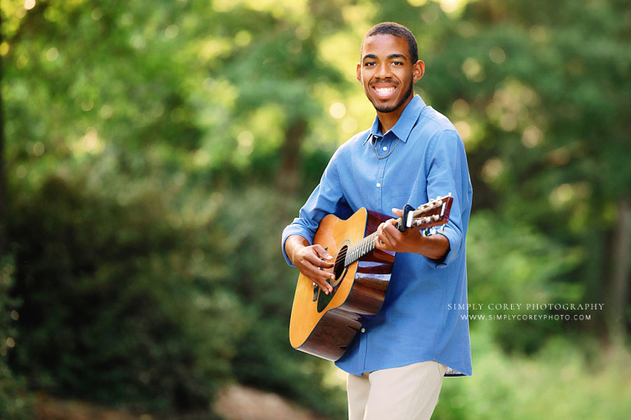 Atlanta senior portrait photographer, teen boy outside with acoustic guitar