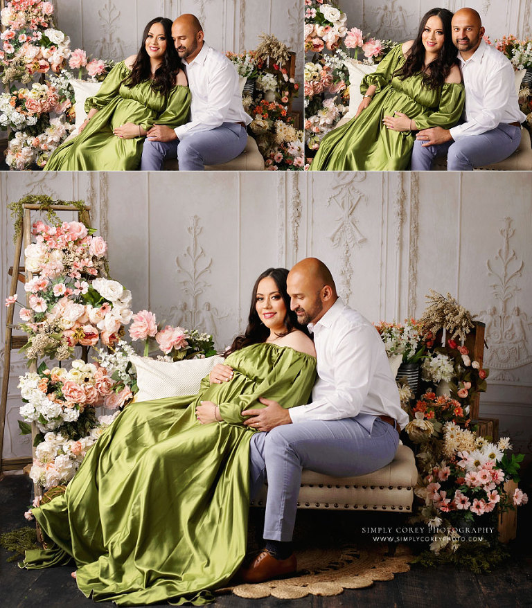 maternity photographer near Carrollton, GA; expecting mom in green with dad in studio