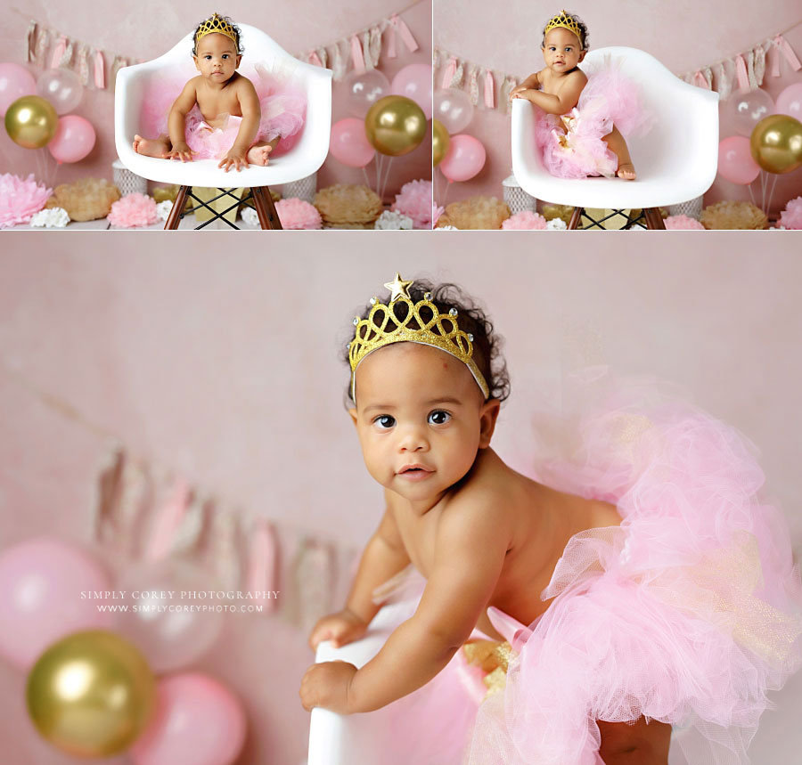 baby photographer near Atlanta, one year old girl with pink tutu and crown in chair during studio session