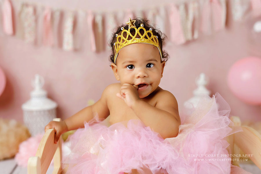 Powder Springs baby photographer, girl in pink tutu and gold crown for milestone session