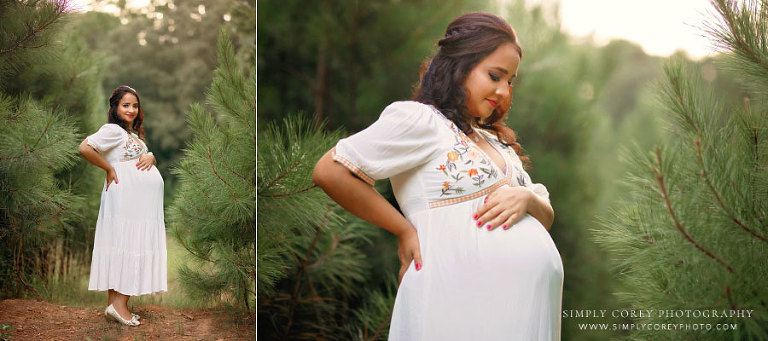 Bremen maternity photographer, expecting mom outside by pine trees