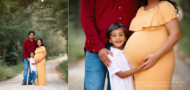 maternity photographer near Lithia Springs, family outside in maroon and gold