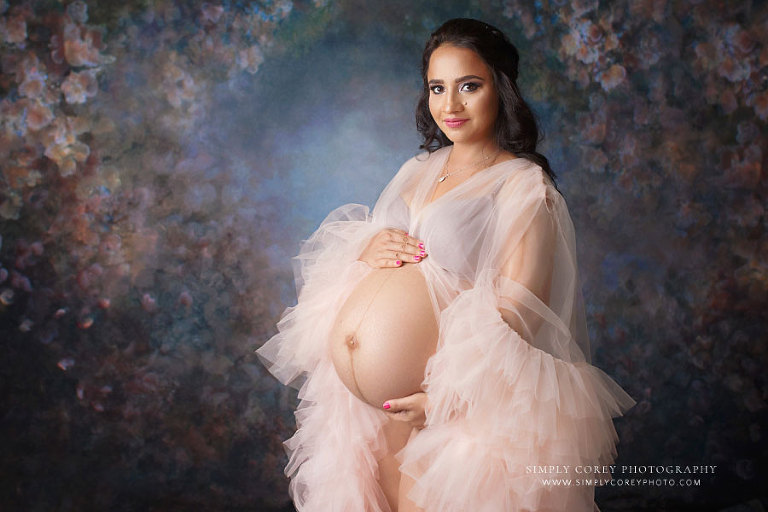 maternity photographer near Powder Springs, studio session with tulle robe and floral backdrop