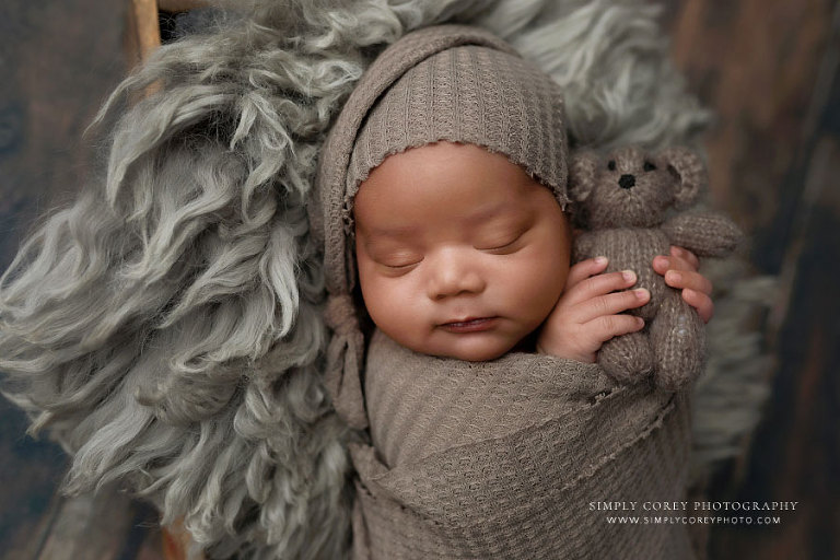 Atlanta newborn photographer, baby boy in sleepy cap with teddy bear