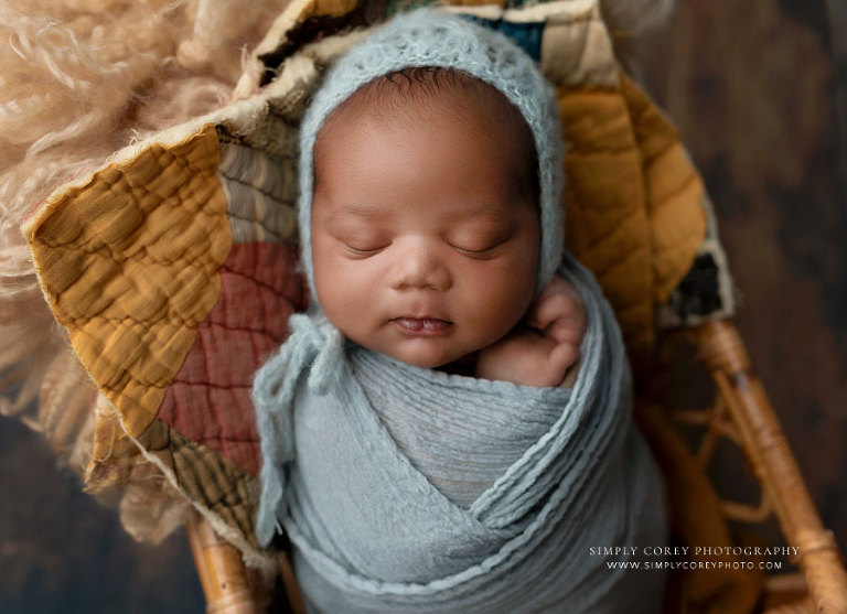 Mableton newborn photographer, baby boy in light blue set with quilt pieces