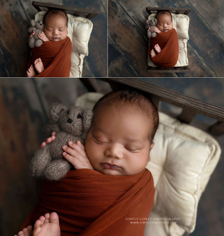 newborn photographer near Villa Rica, baby boy holding a little teddy bear
