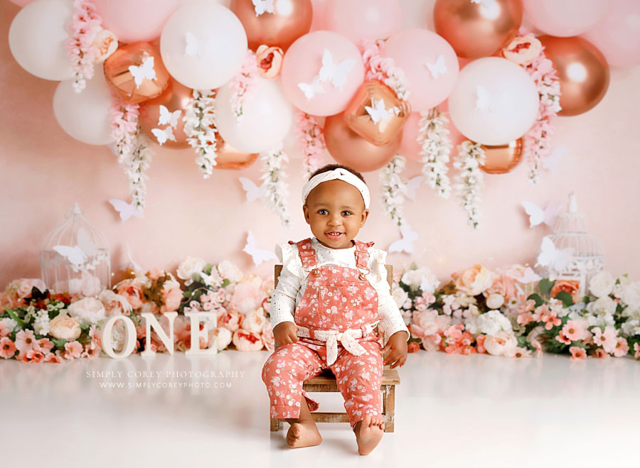 baby photographer near Atlanta, pink butterfly floral milestone session with balloon garland