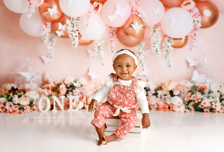 Carrollton baby photographer in Georgia, one year milestone session with florals and balloon garland