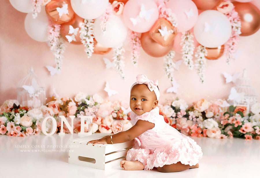 Villa Rica baby photographer, pink butterfly milestone session with florals and balloons
