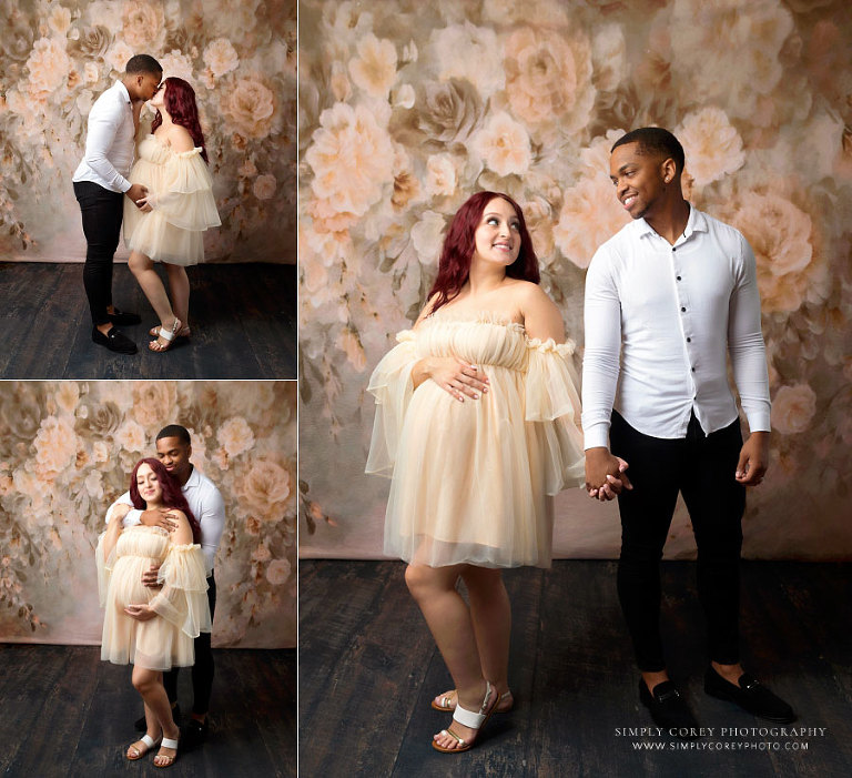 Lithia Springs maternity photographer, studio portraits of expecting couple on floral backdrop