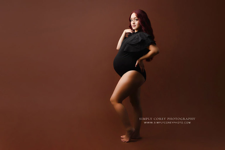 maternity photographer near Atlanta, studio photography of expecting mom in black bodysuit
