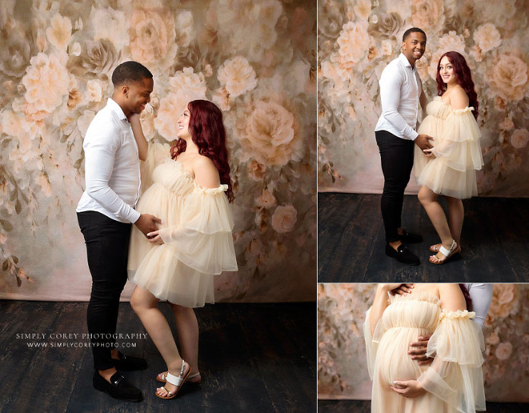 maternity photographer near Douglasville, expecting couple studio session with floral backdrop
