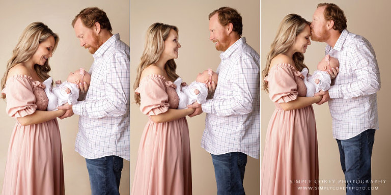 Carrollton family photographer in Georgia, studio portraits of parents holding newborn baby girl