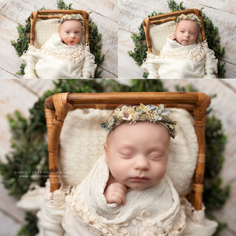 Douglasville newborn photographer, baby girl with flower crown in rattan bed with greenery