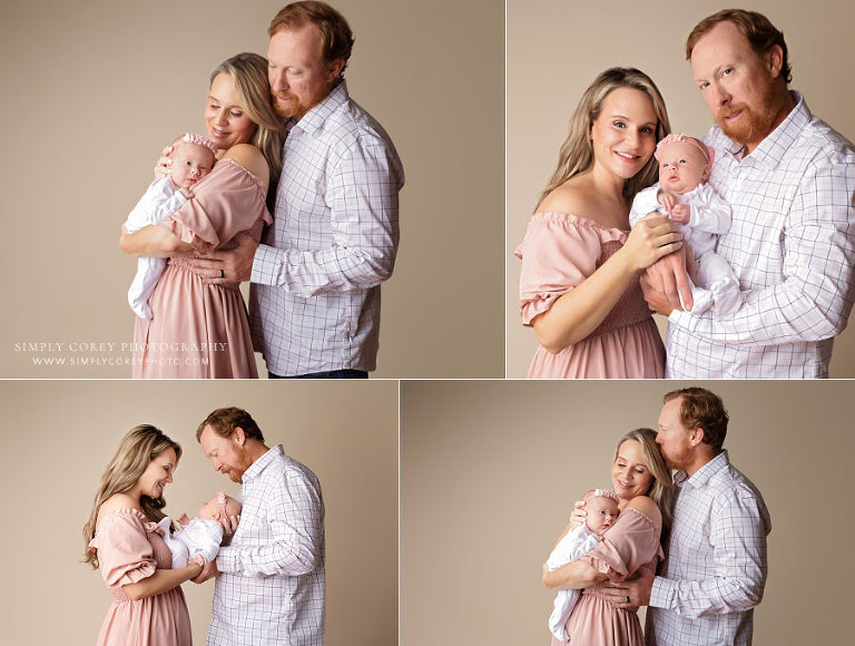 family photographer near Villa Rica, studio portraits of parents with newborn baby girl