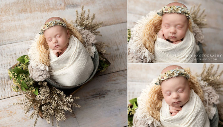 newborn photographer near Austell, baby girl in bucket with light studio set