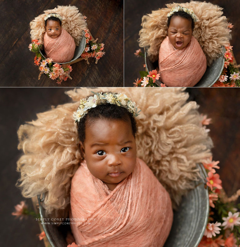 newborn photographer near Dallas, GA; awake baby girl in bucket with funny expressions