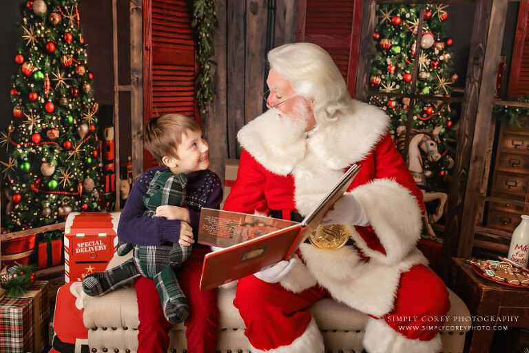 Atlanta mini session photographer, child reading Christmas book with Santa