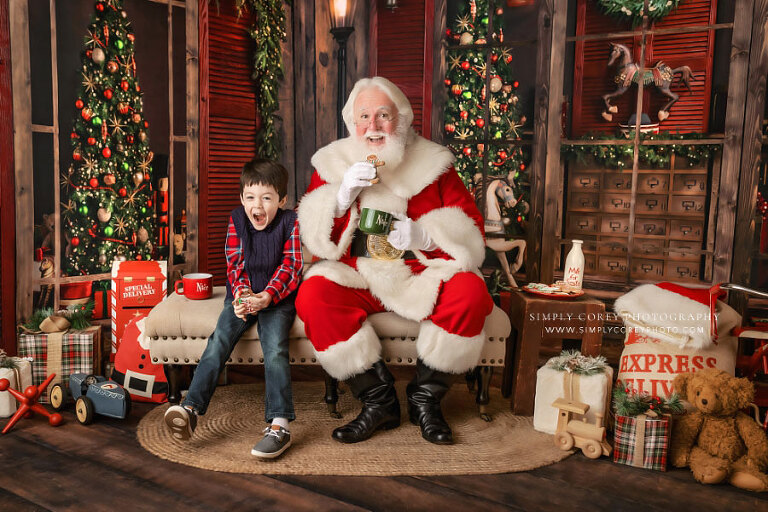 Atlanta photographer Santa Claus mini session, boy with Christmas cookies