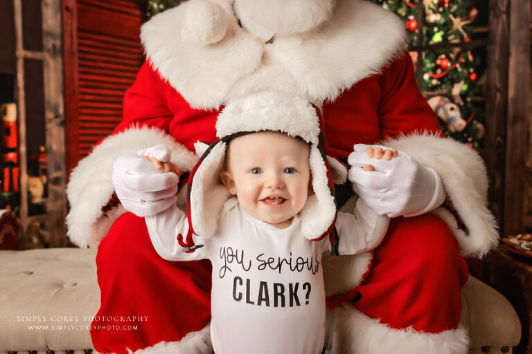 Atlanta Santa mini sessions, baby holding hands with Santa Claus
