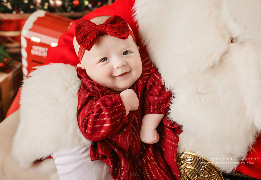 Christmas mini session photographer near Villa Rica, Santa holding baby