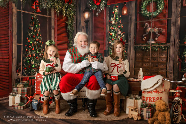 Newnan Christmas mini session photographer, three kids having cookies with Santa