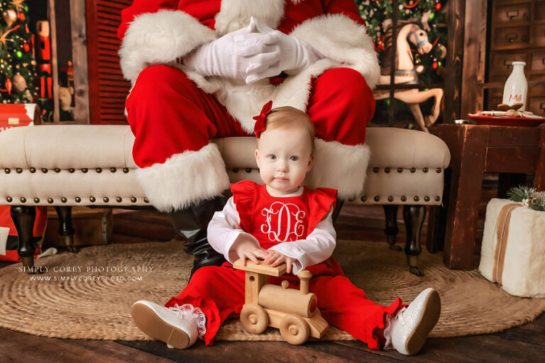Newnan Santa Claus mini session photographer, baby playing with train