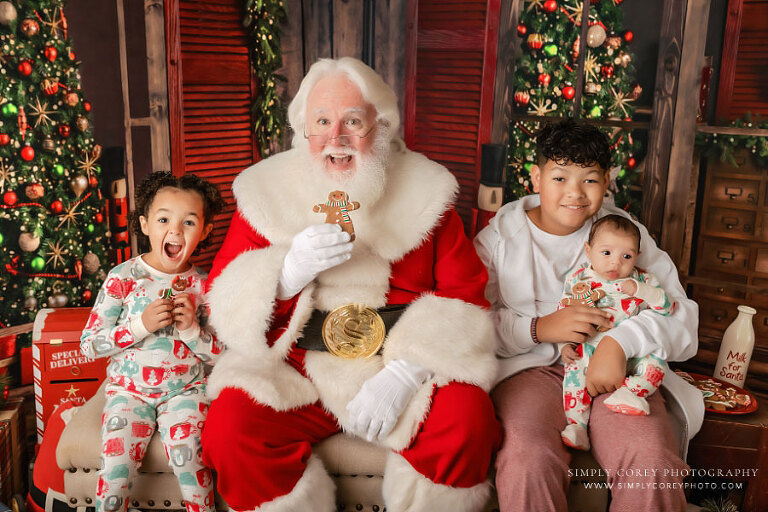Santa mini sessions near Carrollton, GA; kids and baby with cookies
