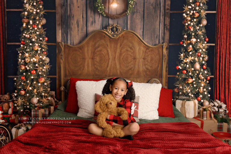 Atlanta mini session photographer, child in Christmas pajamas with bear