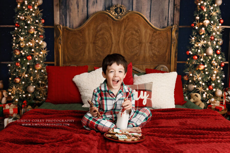 mini session photographer near Atlanta, child in Christmas pajamas with milk and cookies