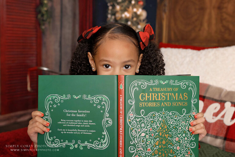 Newnan mini session photographer, child with Christmas book