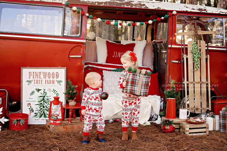 Carrollton mini session photographer in Georgia, children outside with Christmas present and VW bus