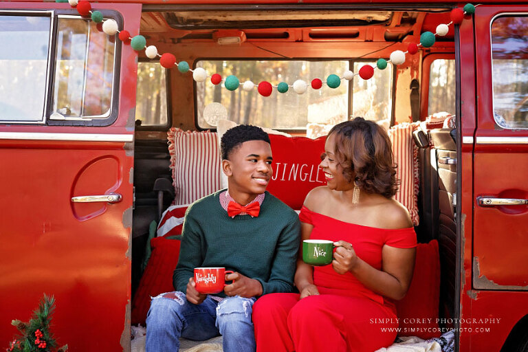 mini session photographer near Hiram, mom and teen son with holiday mugs outside in VW bus