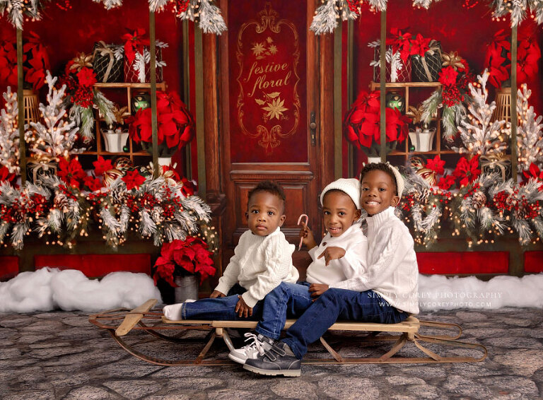 Mableton mini session photographer, three children on sled in studio set