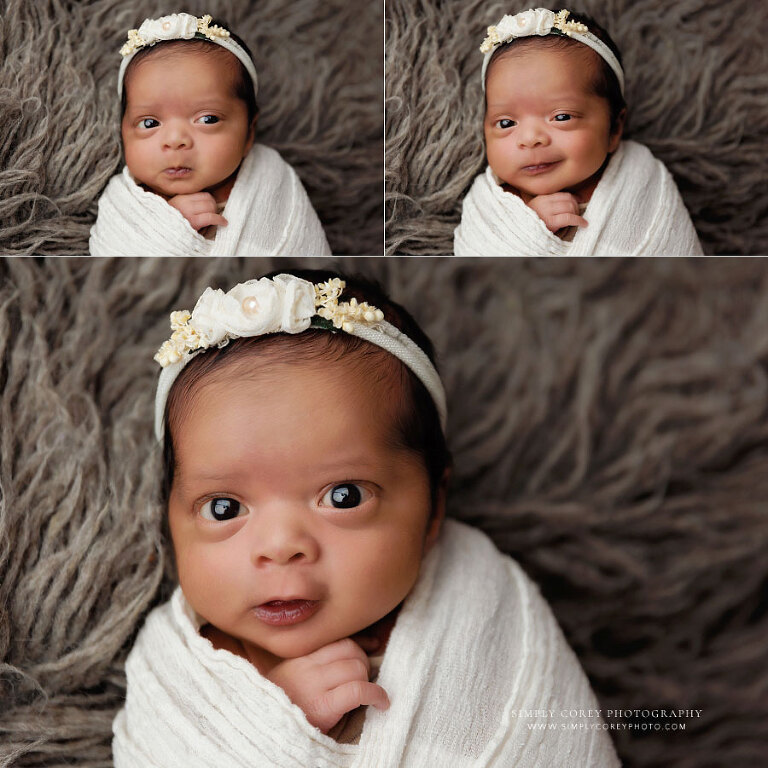 newborn photographer near Douglasville, awake baby girl making funny expressions